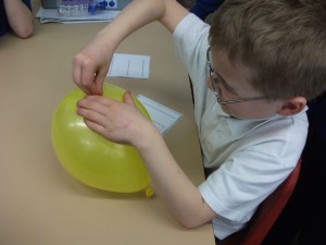What are you doing to that balloon?